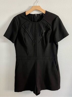 BCBGMaxAzria Black Short-Sleeve Romper with Geometric Lace Insets
